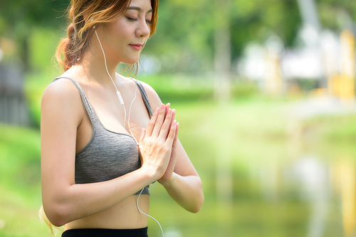 Woman meditating music